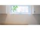 Bright kitchen featuring a large window with a plant and clean design at 851 Quitman St, Denver, CO 80204