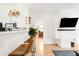 Bright living room featuring bar seating and a view of the kitchen at 851 Quitman St, Denver, CO 80204