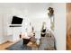 Open-concept living room with a view of the entryway and stylish decor at 851 Quitman St, Denver, CO 80204
