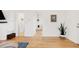 Bright living room featuring hardwood floors, neutral walls, and ample natural light at 851 Quitman St, Denver, CO 80204