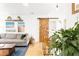 Bright living room with gray sofa, wood accents and decor create a cozy and inviting space at 851 Quitman St, Denver, CO 80204