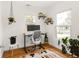 Bright office featuring hardwood floors, an adjustable desk, and ample natural light at 851 Quitman St, Denver, CO 80204
