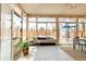 Cozy sunroom with tiled floors, multiple windows, and comfortable seating, bright natural light at 851 Quitman St, Denver, CO 80204