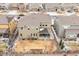 Aerial view of the backyard with a covered patio and landscaping, nestled in a cozy neighborhood at 887 Sundance Ln, Erie, CO 80516