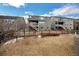 Fenced backyard with a small garden and a covered patio area perfect for entertaining at 887 Sundance Ln, Erie, CO 80516