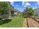Expansive backyard features a wooden fence, garden bed, and landscaping, providing privacy and natural beauty at 887 Sundance Ln, Erie, CO 80516