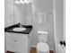 Neat bathroom with vanity, a dark countertop, and white fixtures at 887 Sundance Ln, Erie, CO 80516