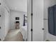 Bedroom featuring carpeted floors and a desk space. En-suite bathroom partially visible at 887 Sundance Ln, Erie, CO 80516