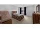 Well-lit bedroom with neutral tones and wood-look furniture at 887 Sundance Ln, Erie, CO 80516