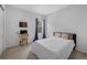 Relaxing bedroom featuring cozy decor, a work desk, and natural lighting at 887 Sundance Ln, Erie, CO 80516