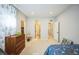 Comfortable bedroom with a cozy bed, dresser, and curtains creating a welcoming and functional space at 887 Sundance Ln, Erie, CO 80516