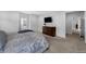 Spacious primary bedroom with a dresser and an en-suite bathroom at 887 Sundance Ln, Erie, CO 80516