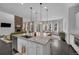 Open-concept kitchen featuring granite countertops, stainless steel appliances and pendant lighting at 887 Sundance Ln, Erie, CO 80516