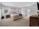 A spacious main bedroom featuring neutral colors and ample natural light at 887 Sundance Ln, Erie, CO 80516