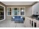 Relaxing outdoor patio with comfortable seating, a grill, and views of the neighborhood at 887 Sundance Ln, Erie, CO 80516