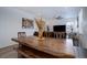 Open-concept living and dining area featuring a dark wood dining table and comfortable seating at 23670 E 41St Ave, Aurora, CO 80019