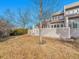 View of the backyard with mature landscaping and a wood fence offers privacy and outdoor enjoyment at 9200 E Cherry Creek South Dr # 29, Denver, CO 80231