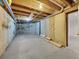 Unfinished basement with concrete walls, exposed ceiling, and utilities at 9200 E Cherry Creek South Dr # 29, Denver, CO 80231