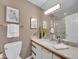 Well-lit bathroom featuring a modern vanity with countertop sink and tiled shower at 9200 E Cherry Creek South Dr # 29, Denver, CO 80231