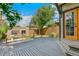 Private backyard featuring a spacious wooden deck and manicured garden, ideal for entertaining or relaxation at 1451 N Gilpin St, Denver, CO 80218