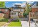 Rear exterior showcases a multi-level wooden deck, patio, and charming backyard for comfortable outdoor living at 1451 N Gilpin St, Denver, CO 80218