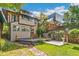 Expansive backyard featuring a wooden deck, patio area, lush lawn, and privacy fence, perfect for outdoor living at 1451 N Gilpin St, Denver, CO 80218