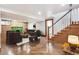 Staged basement with concrete floors, neutral walls, fireplace and staircase at 1451 N Gilpin St, Denver, CO 80218