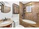 Bathroom featuring mosaic tile walls, a modern shower head, and granite countertops at 1451 N Gilpin St, Denver, CO 80218