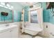 Stylish bathroom featuring a clawfoot tub, pedestal sink and tiled floor at 1451 N Gilpin St, Denver, CO 80218