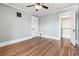 Bedroom featuring hardwood floors, ceiling fan and ample closet space at 1451 N Gilpin St, Denver, CO 80218