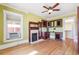 Bright bedroom with hardwood floors and a fireplace at 1451 N Gilpin St, Denver, CO 80218