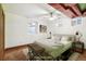 Staged bedroom with concrete floors, neutral walls and ceiling fan at 1451 N Gilpin St, Denver, CO 80218