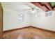 Unfurnished bedroom with concrete floors, neutral walls and ceiling fan at 1451 N Gilpin St, Denver, CO 80218