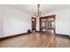 A formal dining room boasting hardwood floors and an elegant lighting fixture at 1451 N Gilpin St, Denver, CO 80218