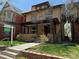 Lovely home featuring a well maintained front yard with mature trees at 1451 N Gilpin St, Denver, CO 80218