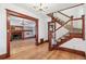 Elegant foyer featuring hardwood floors, a grand staircase, and decorative trim, showcasing the home's character at 1451 N Gilpin St, Denver, CO 80218