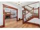 Elegant foyer featuring hardwood floors, staircase, chandelier, and view of the living room at 1451 N Gilpin St, Denver, CO 80218
