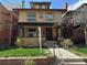 Charming brick home with a covered front porch and well-maintained landscaping at 1451 N Gilpin St, Denver, CO 80218