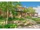 Attractive brick home with a well-kept front yard, a classic design, and a welcoming entrance at 1451 N Gilpin St, Denver, CO 80218