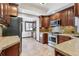 Kitchen featuring stainless steel appliances, granite countertops, and wood cabinets at 1451 N Gilpin St, Denver, CO 80218
