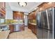 Kitchen featuring stainless steel appliances, granite countertops, and wood cabinets at 1451 N Gilpin St, Denver, CO 80218