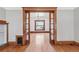 Elegant living room showcasing wood trim, hardwood floors, and ample natural light at 1451 N Gilpin St, Denver, CO 80218