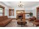 Staged living room with fireplace, wood trim, modern lighting, and hardwood floors at 1451 N Gilpin St, Denver, CO 80218