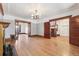 Spacious living room with hardwood floors, detailed ceiling trim, and open doorways at 1451 N Gilpin St, Denver, CO 80218