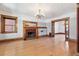 Bright living room features hardwood floors, decorative ceilings, and a cozy fireplace at 1451 N Gilpin St, Denver, CO 80218