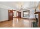 Inviting living room with classic details, featuring a decorative fireplace, hardwood floors, and pocket doors at 1451 N Gilpin St, Denver, CO 80218