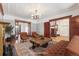 Living room with hardwood floors, period trim, and updated lighting at 1451 N Gilpin St, Denver, CO 80218