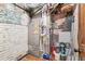 Utility room with furnace, brick walls and plumbing at 1451 N Gilpin St, Denver, CO 80218
