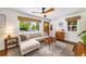 Comfortable living room with a sectional sofa, hardwood floors, and a stylish rug at 2535 S Julian St, Denver, CO 80219
