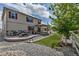 Manicured backyard featuring a covered patio, stamped concrete, and beautiful landscaping at 5789 Echo Park Cir, Castle Rock, CO 80104